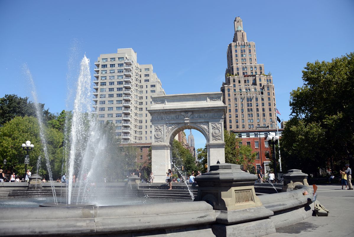 07 New York Washington Square Park Fountain And Washington Arch With 2 Fifth Ave, Empire State Building, One Fifth Ave
